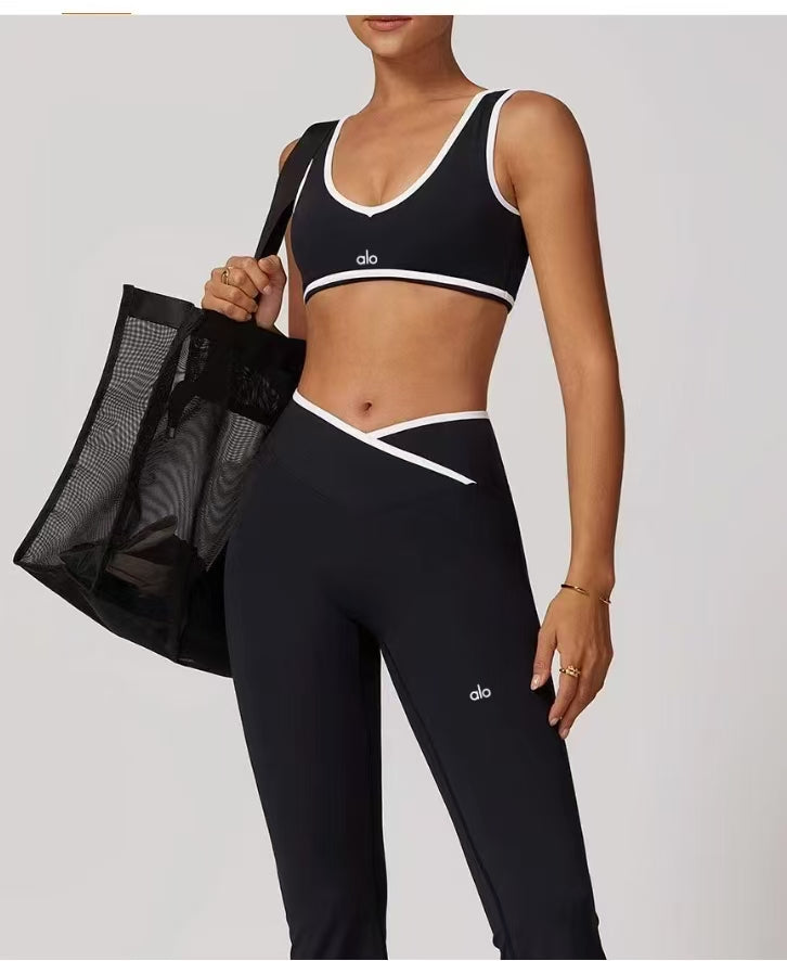 Alo Inspired Black & White Crossover Legging Set – High-waisted V-cut leggings & matching sports bra. Perfect for gym, yoga, or lounge wear.