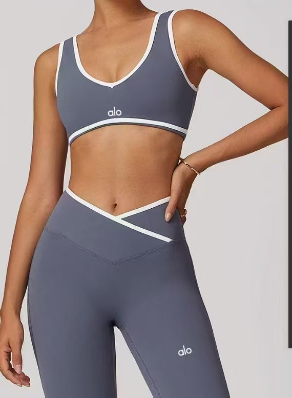 Alo Inspired Black & White Crossover Legging Set – High-waisted V-cut leggings & matching sports bra. Perfect for gym, yoga, or lounge wear.