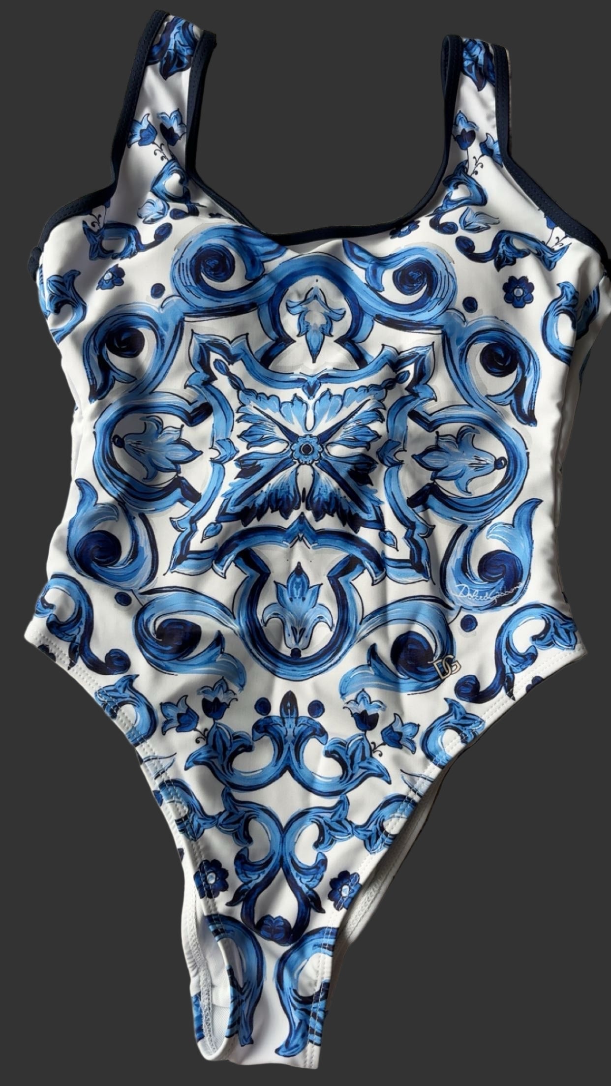 One-piece swimsuit with blue and white intricate pattern