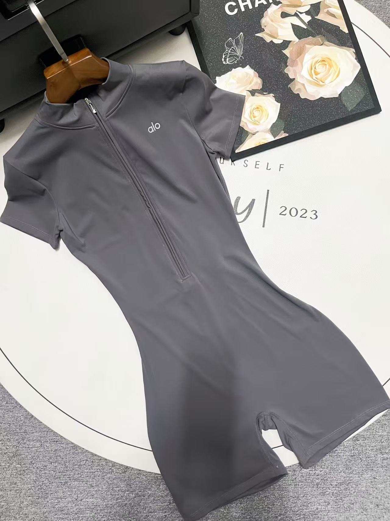 Sculpting alo Yoga Zip Up One-Piece for Women | Neutral Luxe Loungewear Short Sleeved Solid Color Spandex Snatched Fit